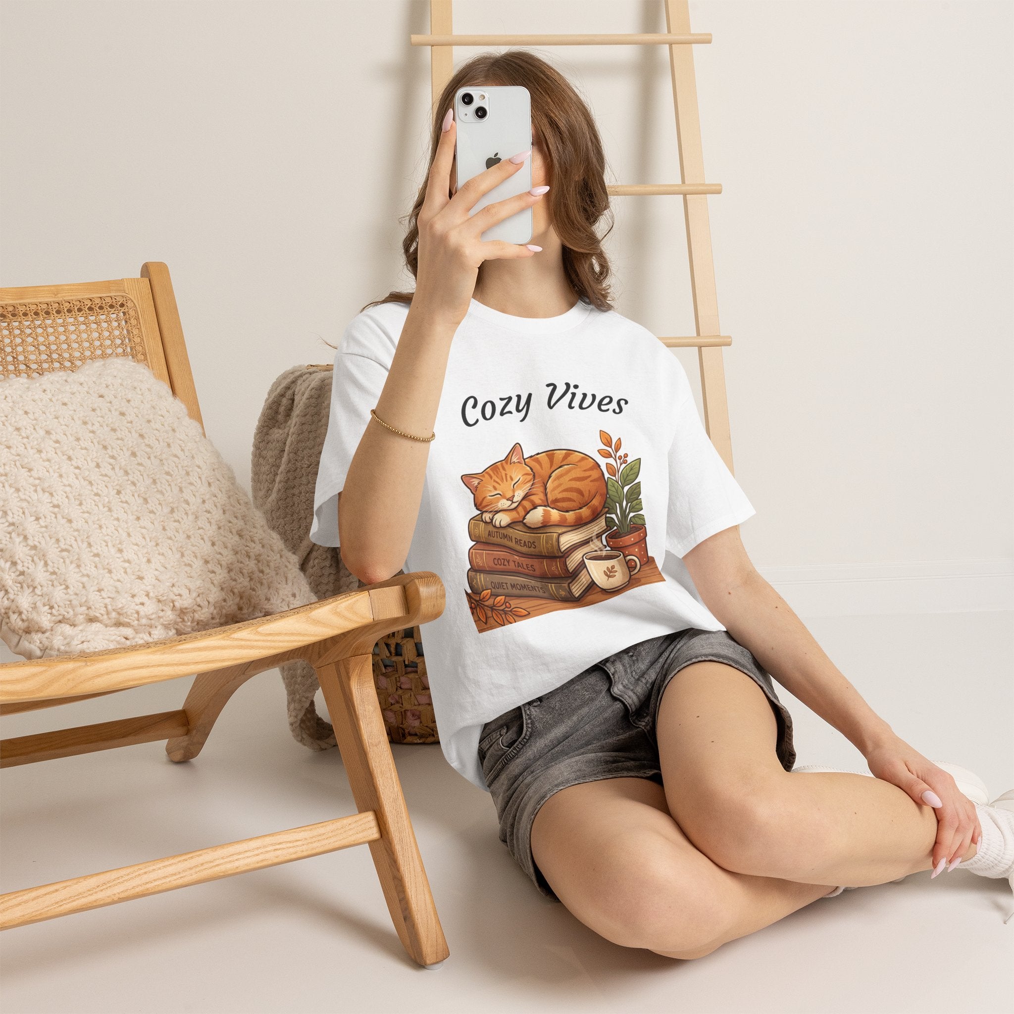 Cozy Dives T‑Shirt — Cute Cat on Books & Plants Graphic Tee for Book Lovers
